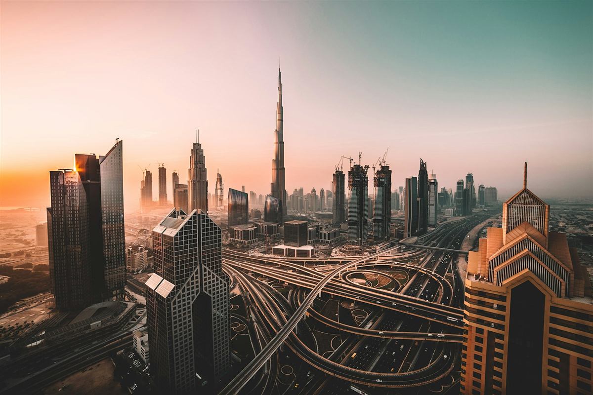 Dubai skyline with the Burj Khalifa glowing at sunset