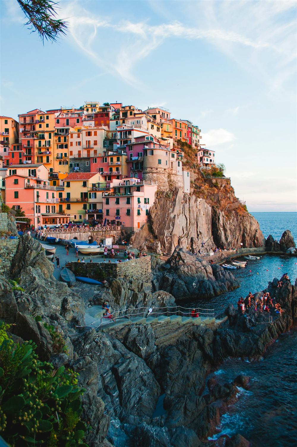 Pastel-coloured village clinging to a seaside cliff in Cinque Terre